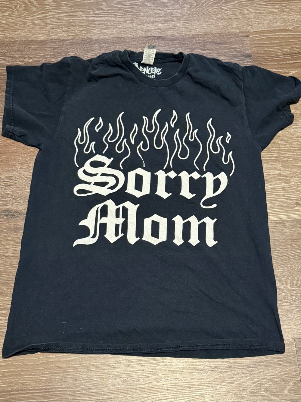 Spencer's Black Tee with White 'Sorry Mom' Flame Graphic